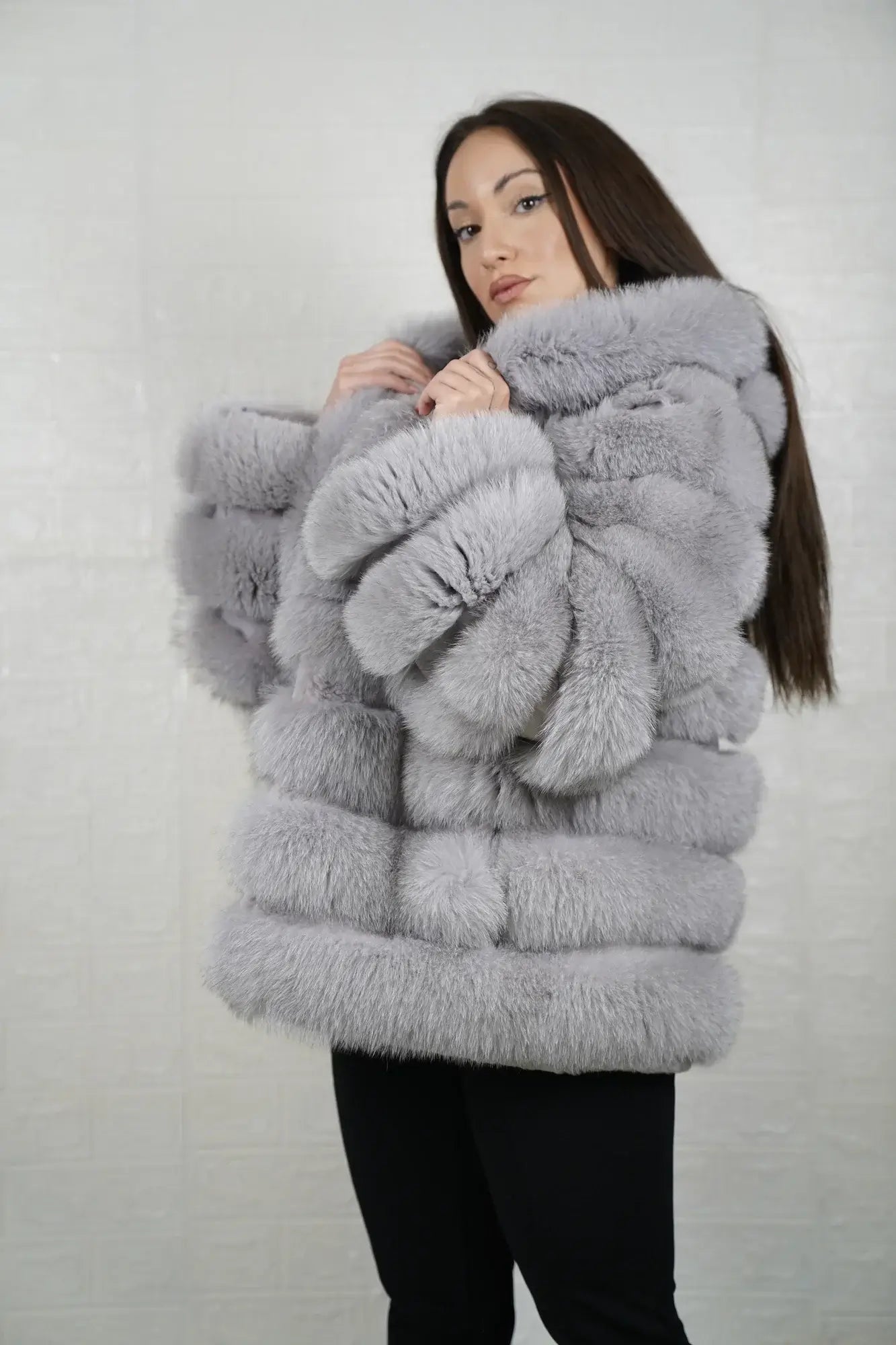 Gray fox fur jacket shown from the side displaying above hip silhouette and horizontal rabbit trim framed atmospheric gray fox rows — Greek craftsmanship, TatiFurs
