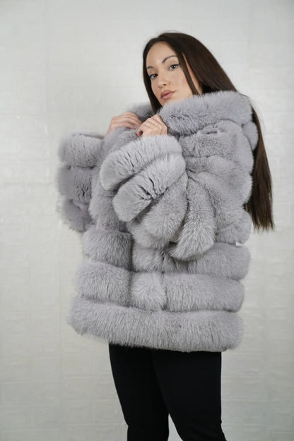 Gray fox fur jacket shown from the side displaying above hip silhouette and horizontal rabbit trim framed atmospheric gray fox rows — Greek craftsmanship, TatiFurs
