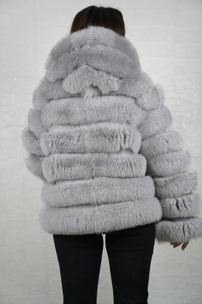 Gray fox fur jacket shown from the back displaying full above hip silhouette and horizontal rabbit trim construction across gray fox rows — Greek craftsmanship, TatiFurs
