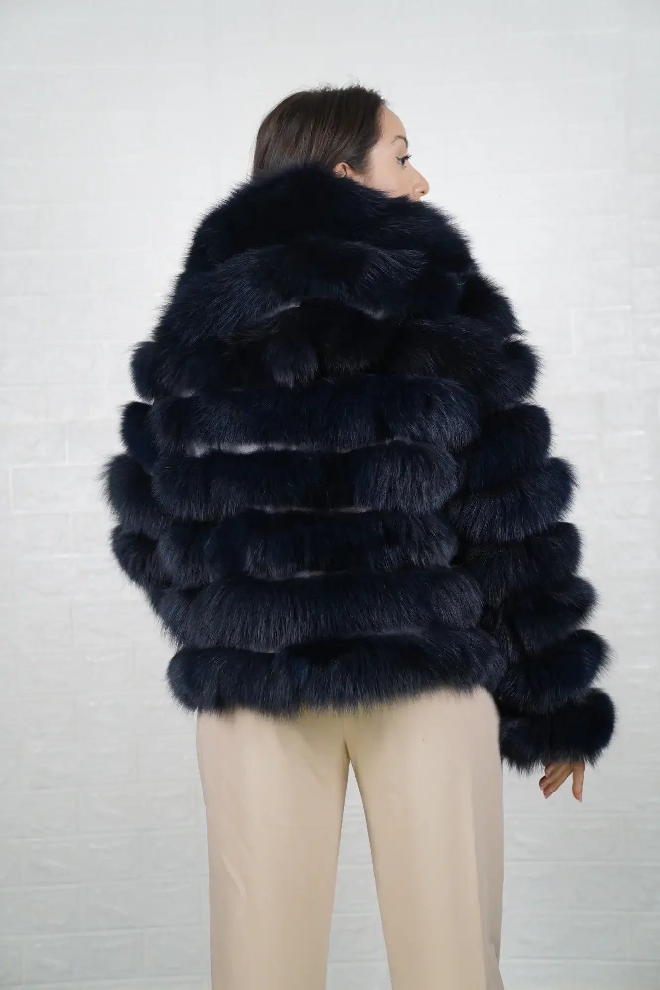 Fox fur jacket blue shown from the side displaying above hip silhouette and horizontal leather framed luminous blue fox rows — Greek craftsmanship, TatiFurs
