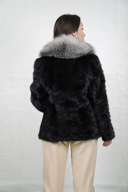 Mink fur jacket black fox collar shown from the back displaying full hip level silhouette and uniform black patchwork mink surface — Greek craftsmanship, TatiFurs
