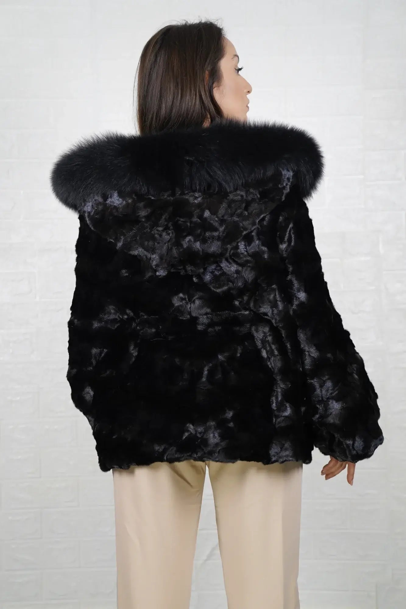 Mink fur cape black fox trim hood shown from the back displaying full hip level silhouette and uniform black patchwork mink surface — Greek craftsmanship, TatiFurs
