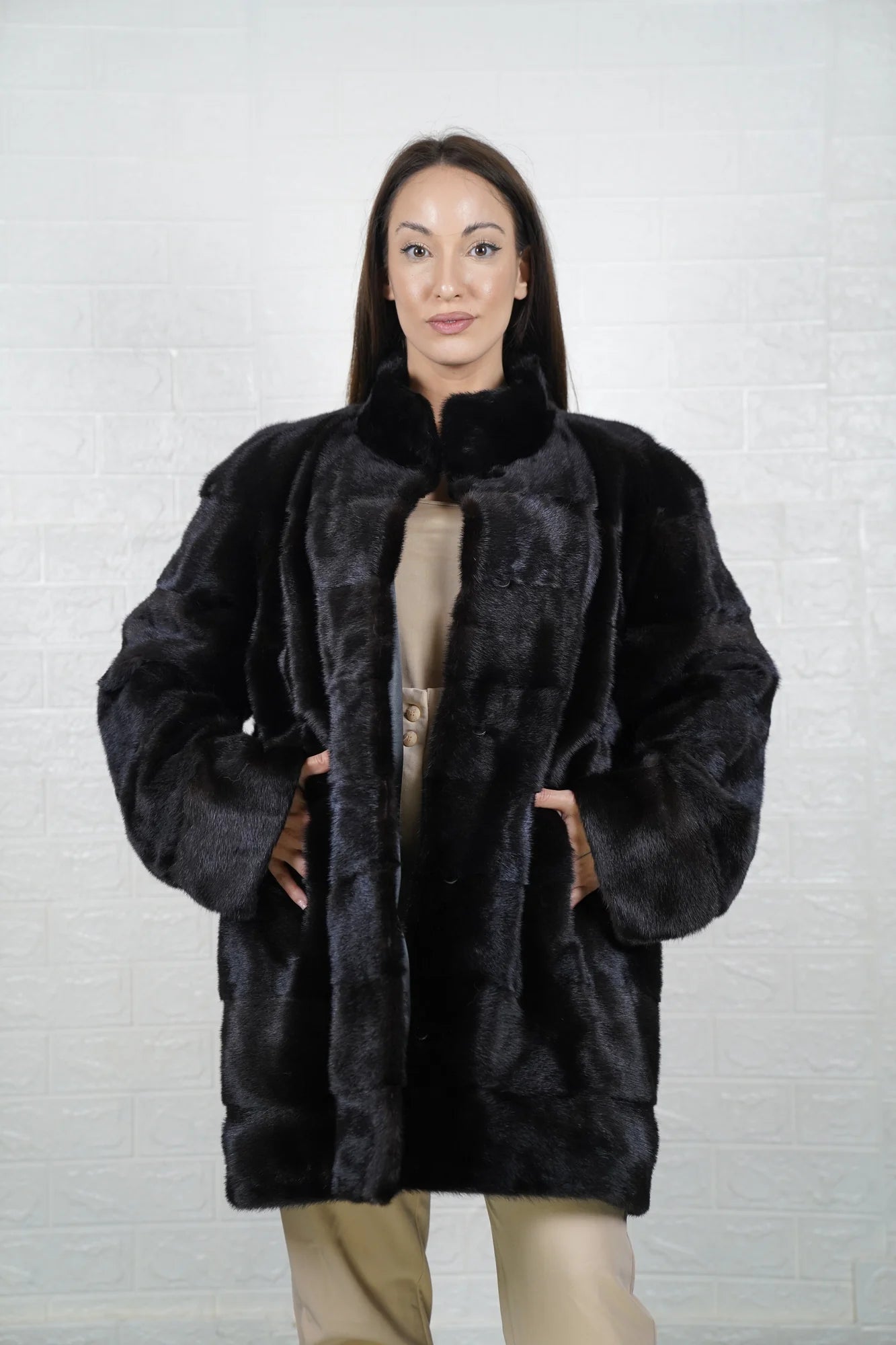 Mink fur coat black shown from the side displaying above the knee silhouette and natural black mink drape from collar to hem — Greek craftsmanship, TatiFurs
