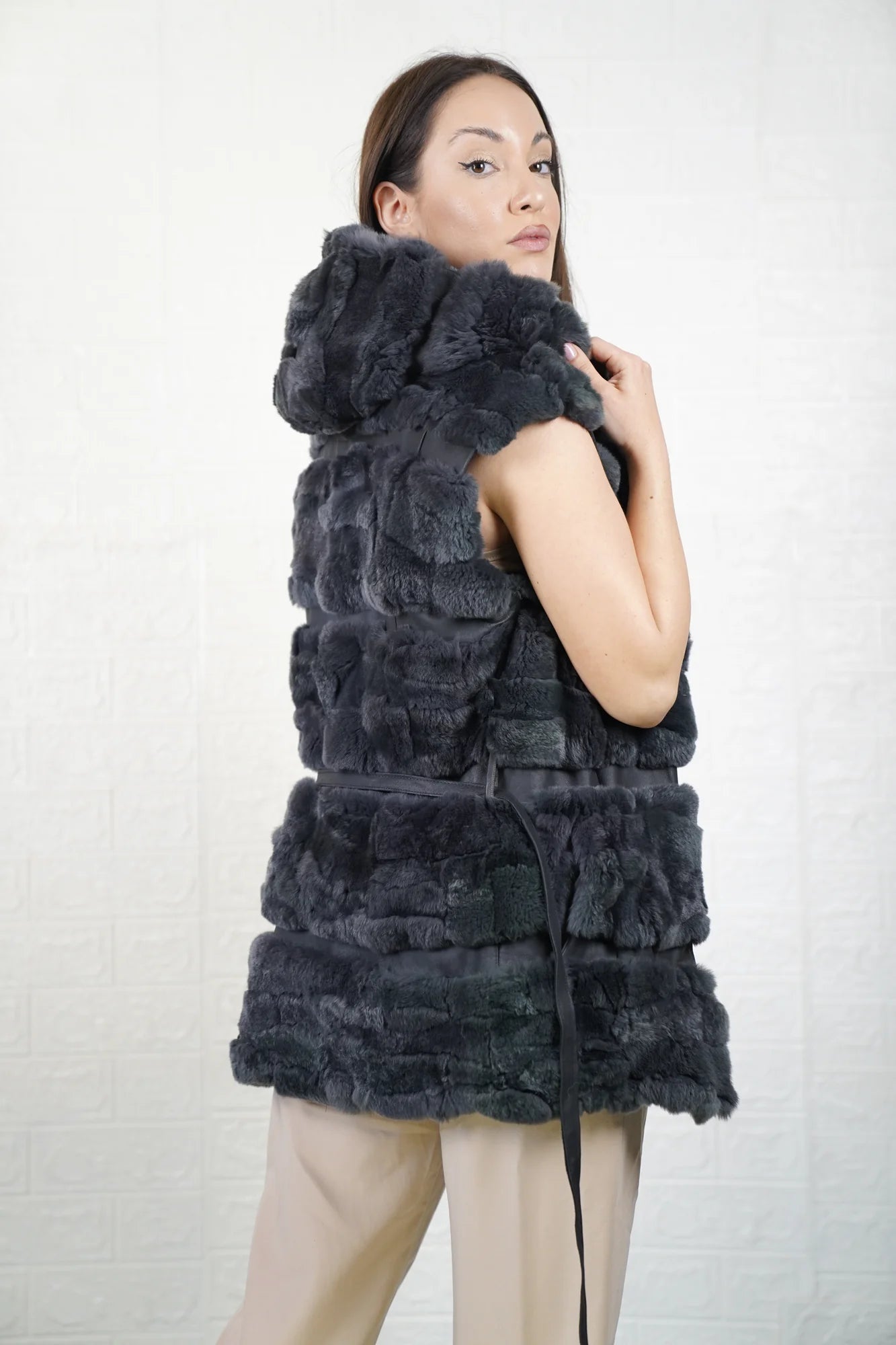 Rex rabbit fur vest gray shown from the side displaying below hip silhouette and horizontal leather framed cool gray rex rabbit rows — Greek craftsmanship, TatiFurs
