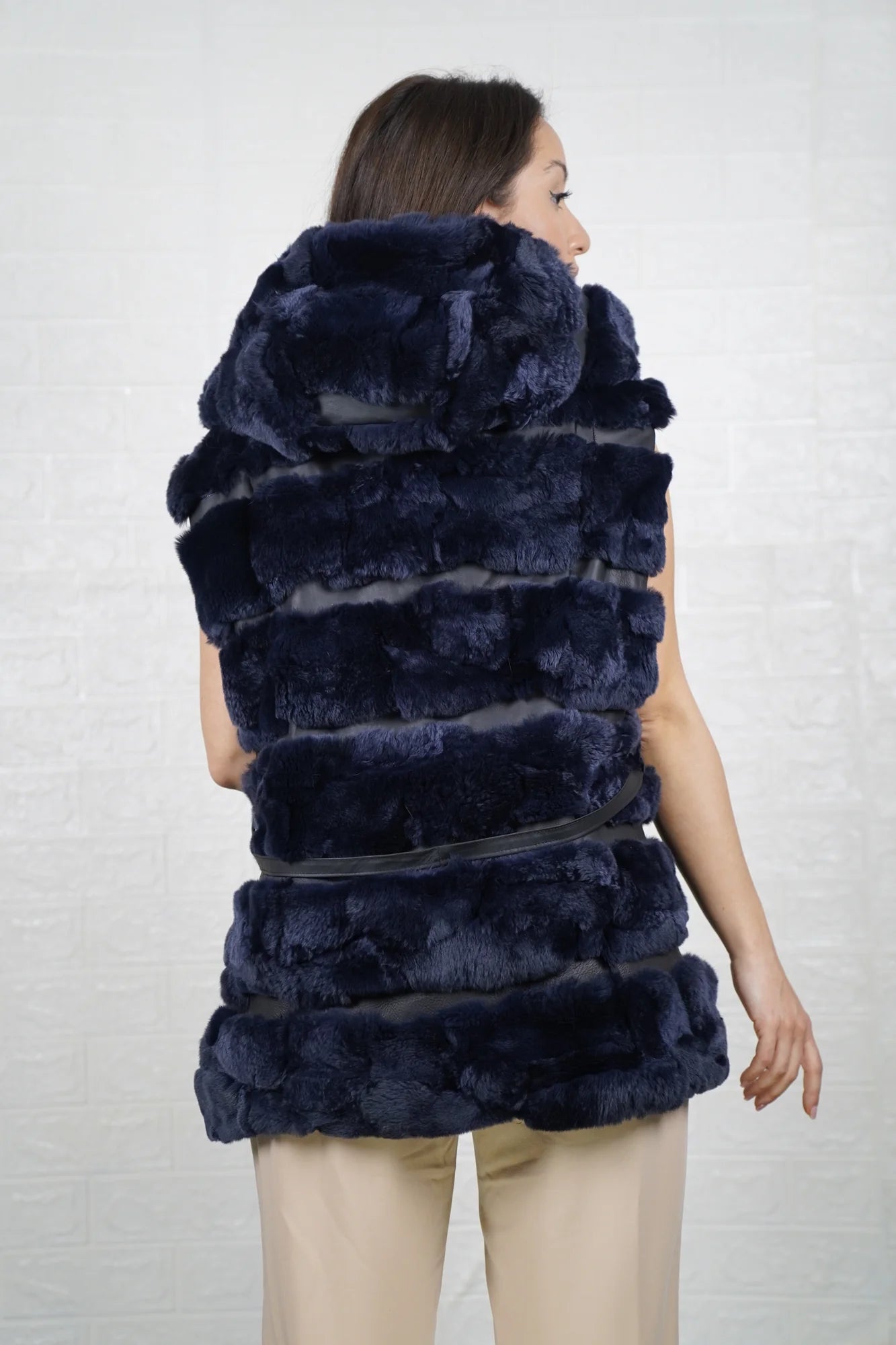 Rex rabbit fur vest blue shown from the back displaying full below hip silhouette and horizontal leather strip construction across blue rex rabbit rows — Greek craftsmanship, TatiFurs
