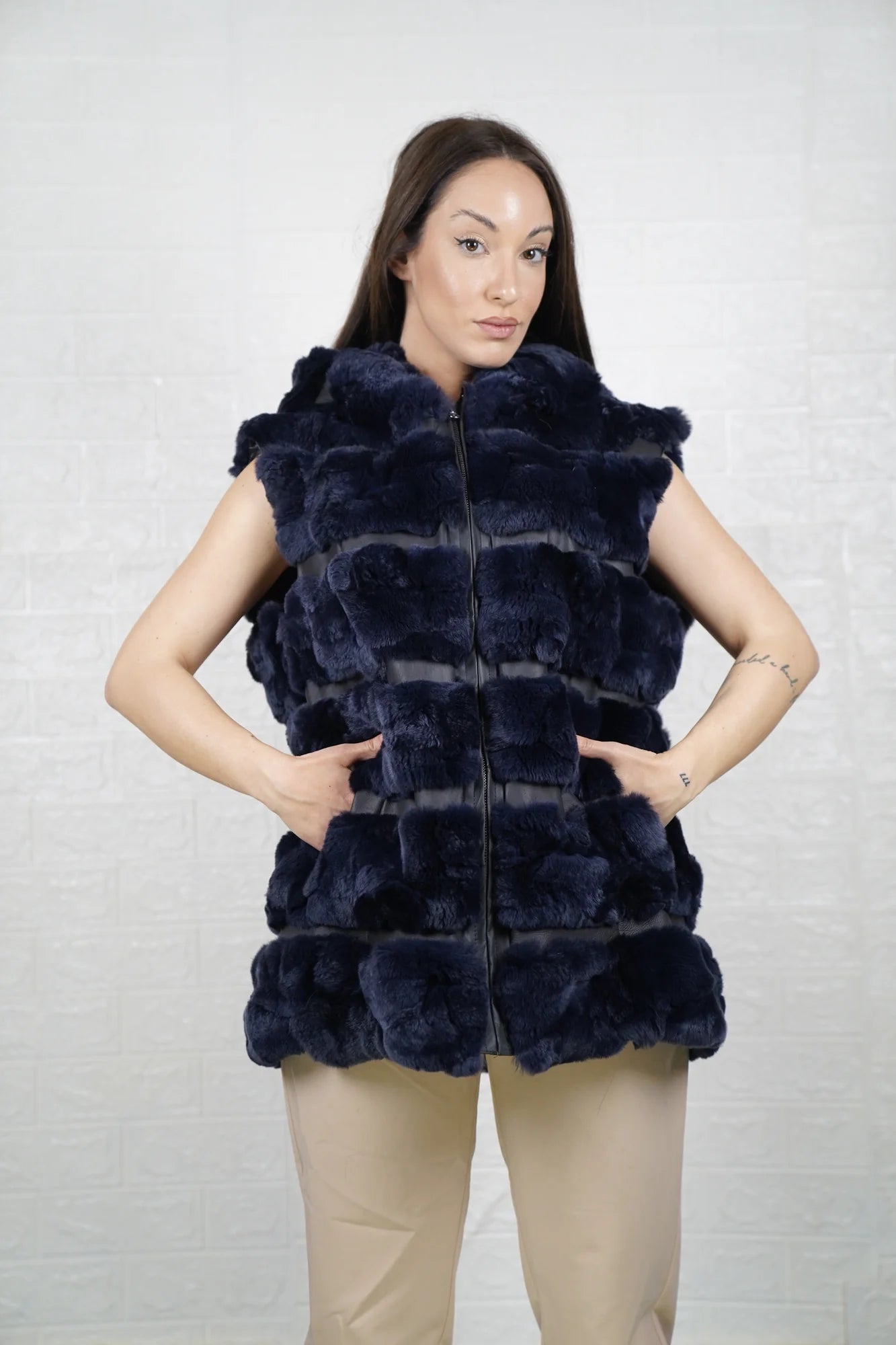 Rex rabbit fur vest blue shown from the side displaying below hip silhouette and horizontal leather framed luminous blue rex rabbit rows — Greek craftsmanship, TatiFurs
