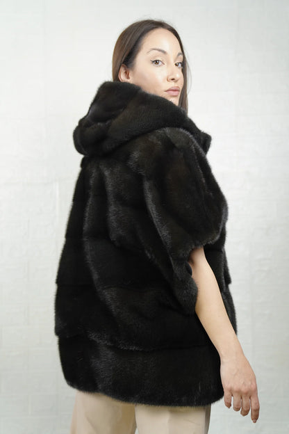 Mink fur cape dark green close-up texture showing skin on skin vertical pelt flow and rich dimensional dark green mink depth
