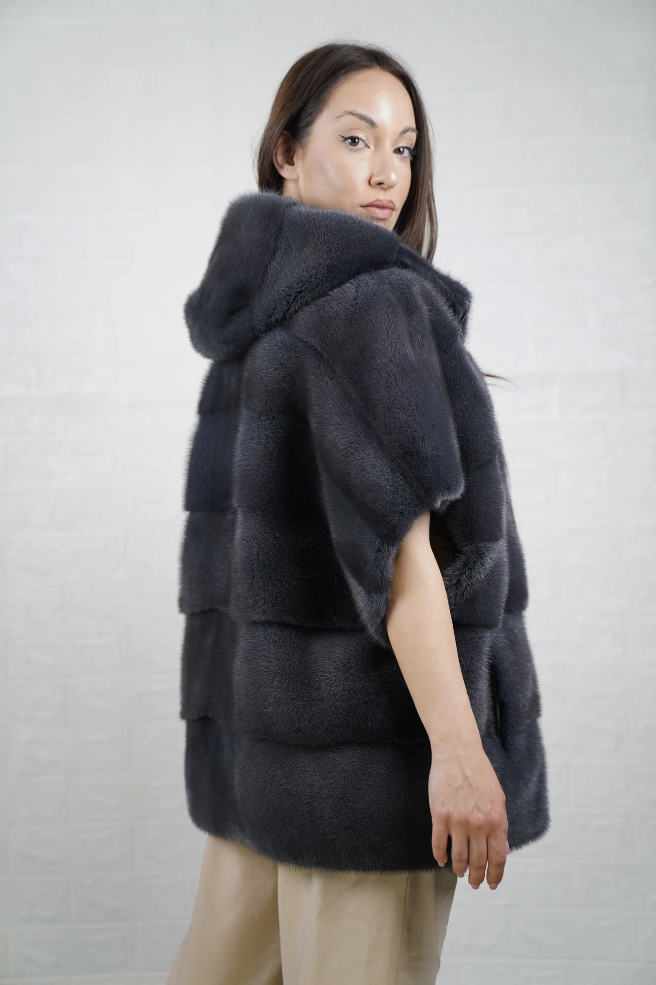 Mink fur cape gray with hood raised showing cool gray mink framing the face and short sleeve construction detail
