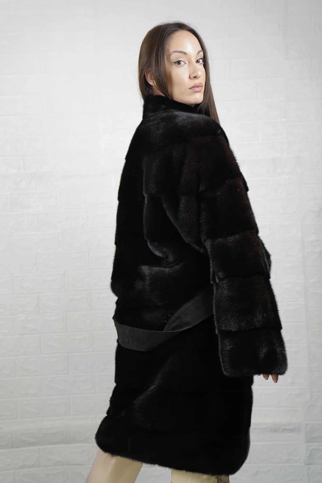 Mink fur coat dark brown collared long with belt close-up texture showing skin on skin pelt flow and deep warm dark brown mink depth — Greek craftsmanship, TatiFurs
