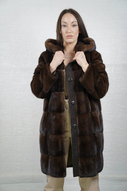 Mink fur coat brown with hood worn up showing mink lined hood framing face in deep warm brown matched to coat body — Greek craftsmanship, TatiFurs
