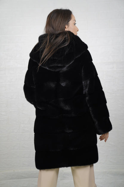 Mink fur coat black with hood shown from the back displaying full above the knee silhouette and deep consistent black skin on skin mink flow — Greek craftsmanship, TatiFurs
