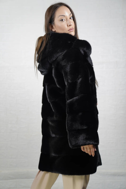Mink fur coat black with hood displayed showing deep consistent black tone and full above the knee silhouette — Greek craftsmanship, TatiFurs
