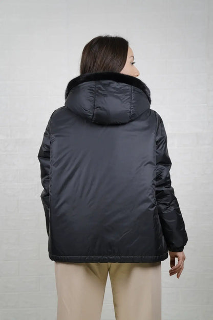Mink fur jacket reversible black shown from the side displaying hip level silhouette and solid flat black mink surface — Greek craftsmanship, TatiFurs
