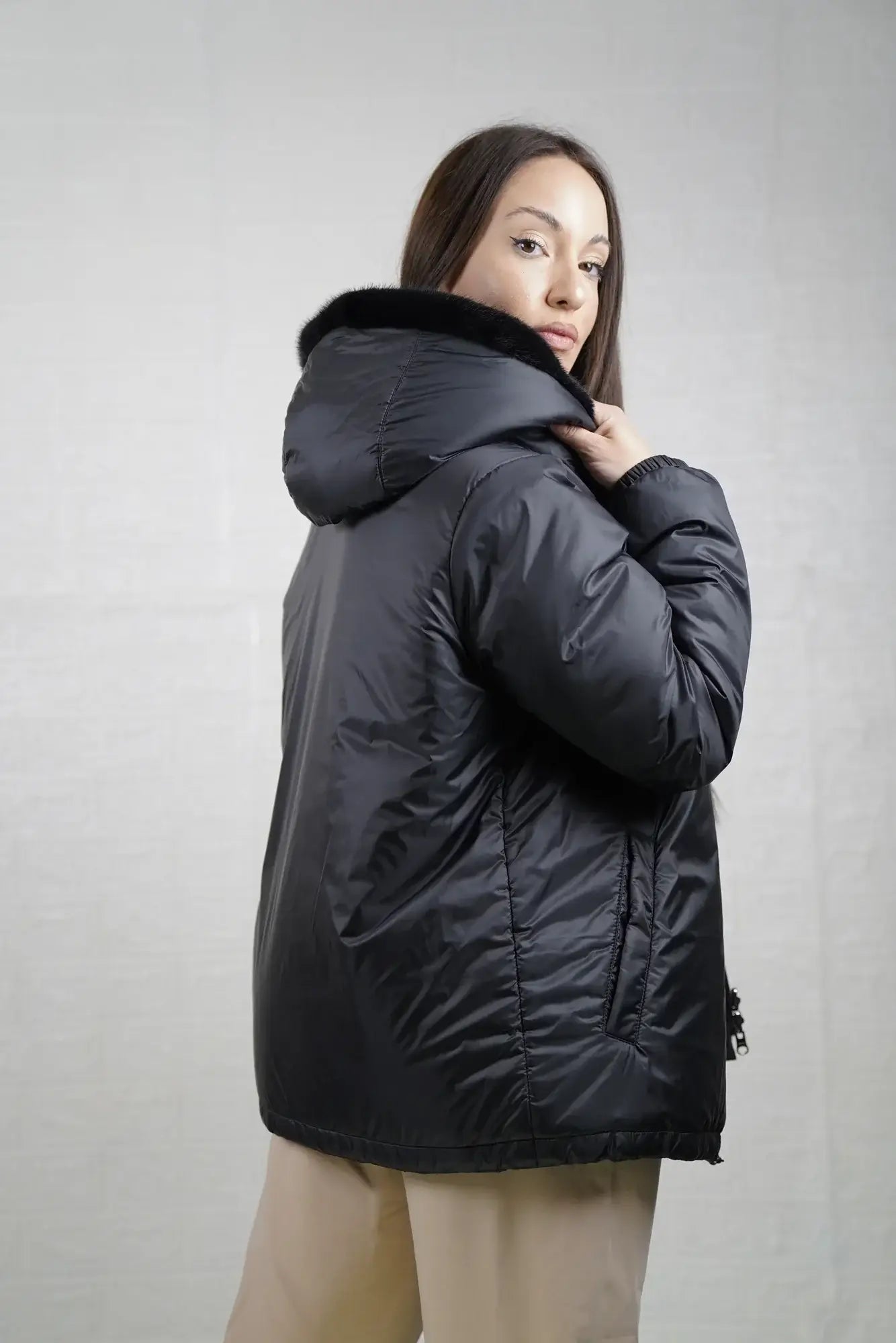 Mink fur jacket reversible black displayed synthetic side showing clean black exterior and short hooded hip level silhouette reversed — Greek craftsmanship, TatiFurs
