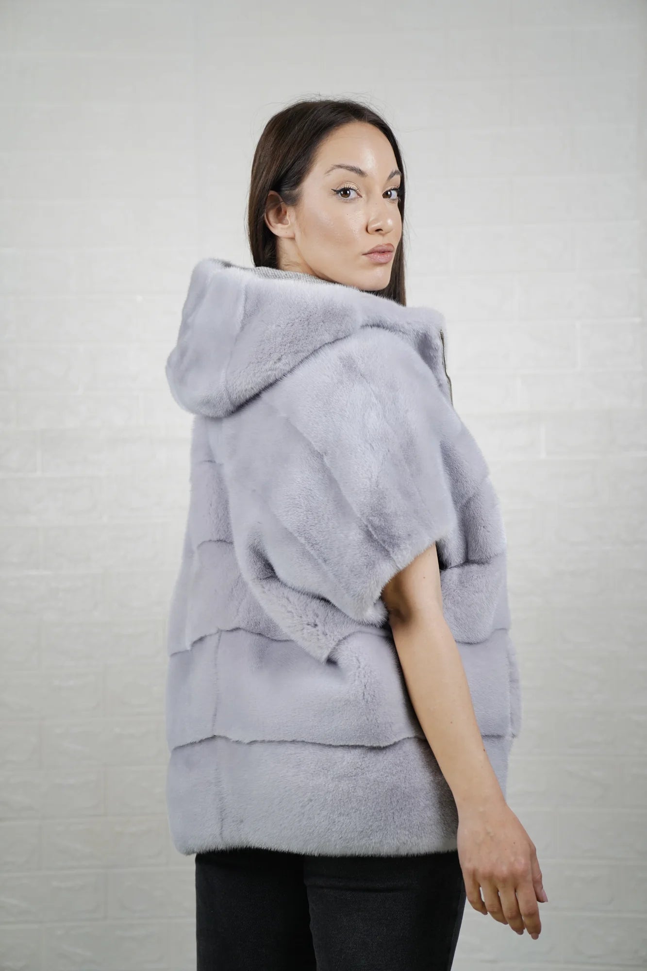 Mink fur cape purple women shown full length from front displaying short sleeved hooded silhouette and deep purple skin on skin flow

