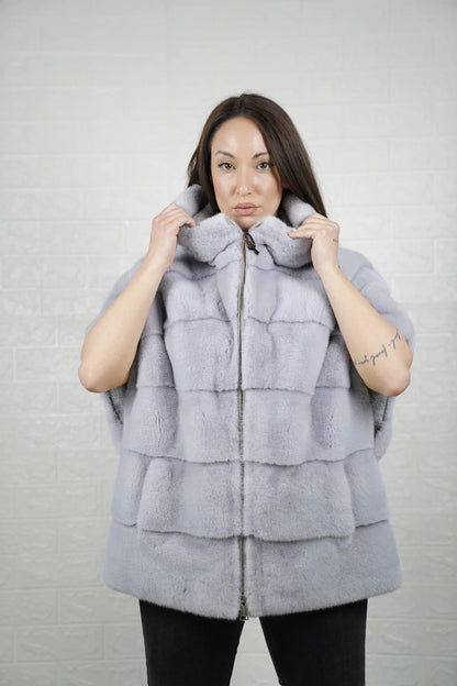 Mink fur cape purple shown from the back displaying hooded short sleeved silhouette and fluid skin on skin purple mink drape
