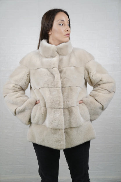 Mink fur jacket light beige women shown full length from front displaying mid length collared silhouette and clean hidden button closure
