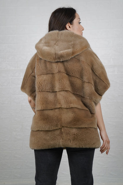 Mink fur cape brown shown from the back displaying hooded short sleeved silhouette and fluid skin on skin natural brown mink drape
