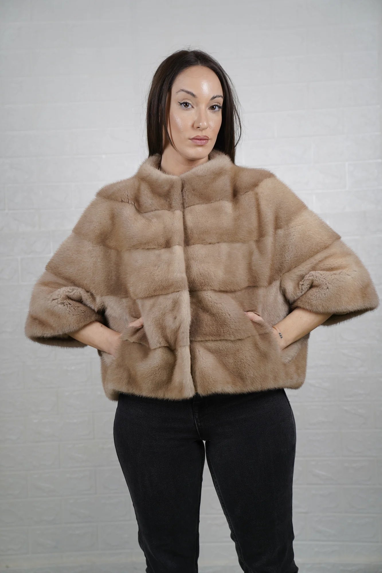 Mink fur jacket brown women shown full length from front displaying clean short bomber silhouette and deep warm brown skin on skin flow
