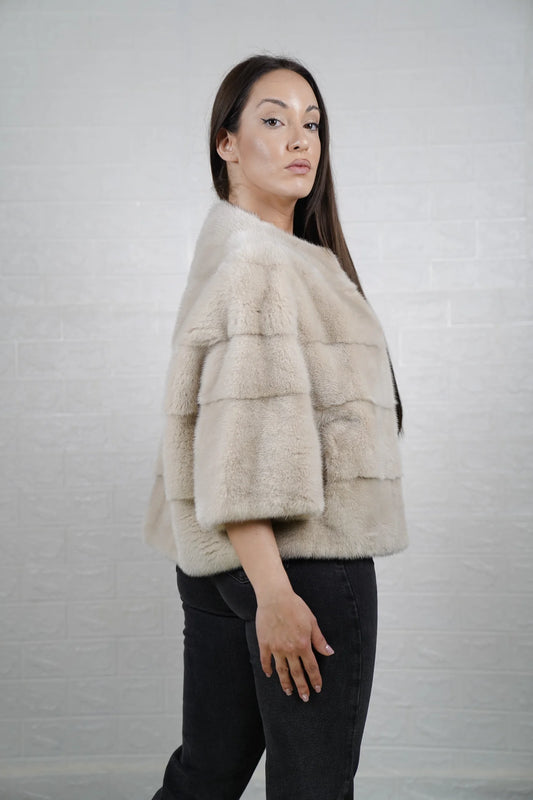 Mink fur jacket beige bomber displayed draped showing soft warm natural beige tone and clean short bomber silhouette — Greek craftsmanship, TatiFurs
