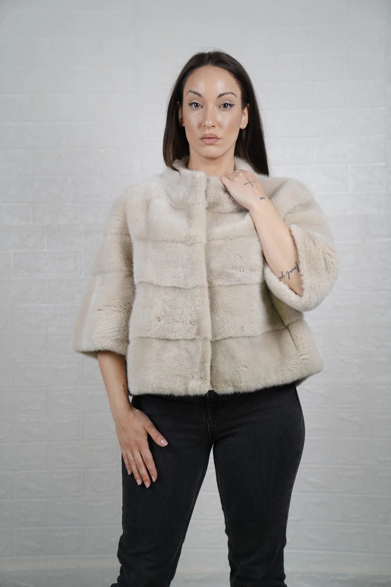 Mink fur jacket beige bomber shown from the side displaying clean collarless silhouette and soft warm natural beige mink drape — Greek craftsmanship, TatiFurs
