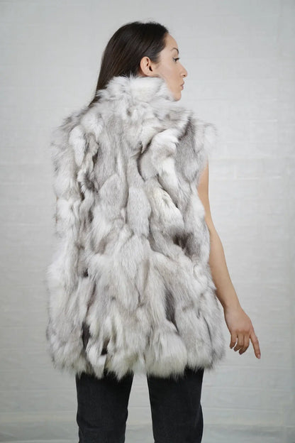 Fox fur vest blue natural shown from the back displaying full below hip silhouette and consistent cool luminous natural blue fox surface — Greek craftsmanship, TatiFurs
