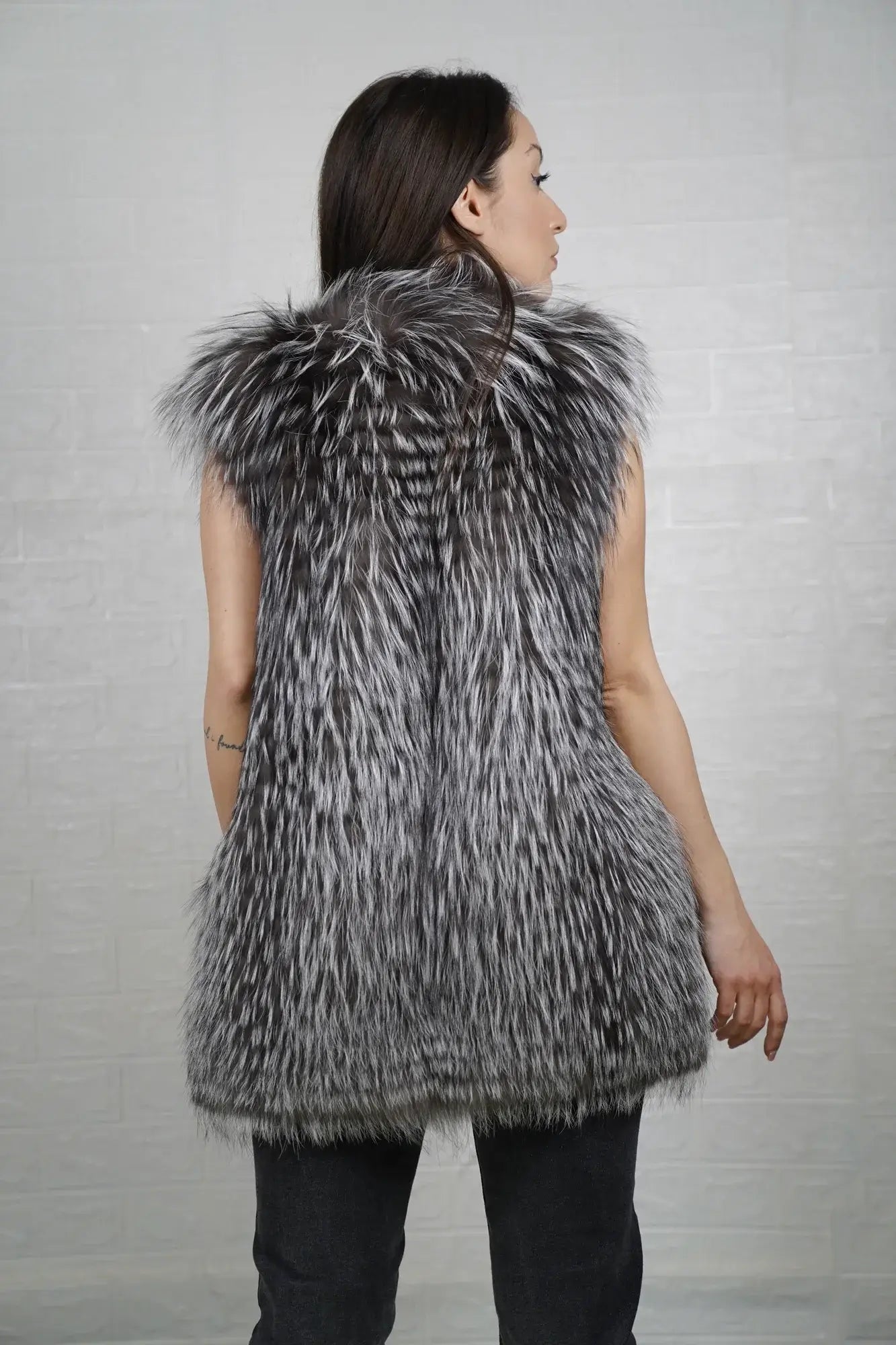 Fox fur vest silver shown from the back displaying full below hip silhouette and consistent luminous silver fox full skin surface — Greek craftsmanship, TatiFurs
