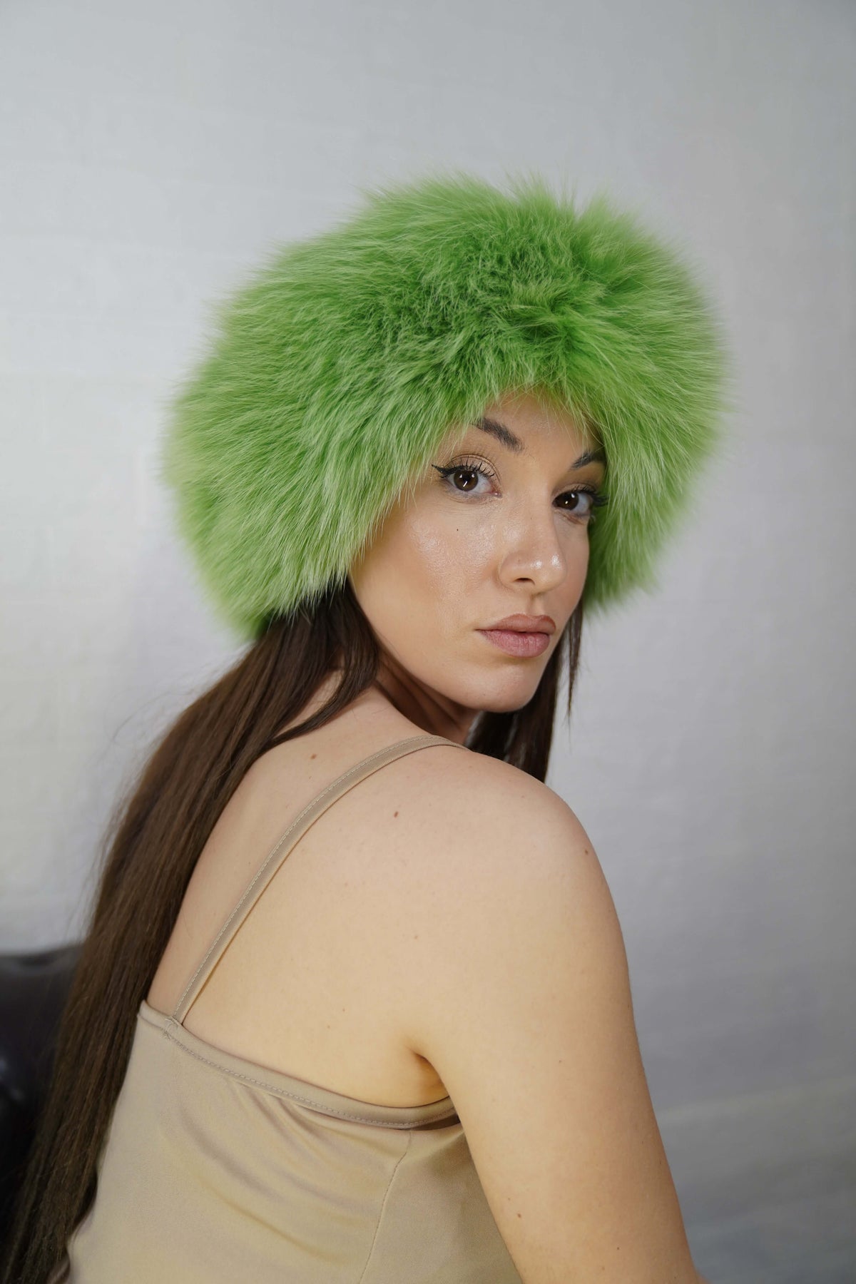 Fox Fur Headband Green — Full Skin, Elastic worn by a model, showcasing the fresh apple green fur framing the face in winter style — TatiFurs
