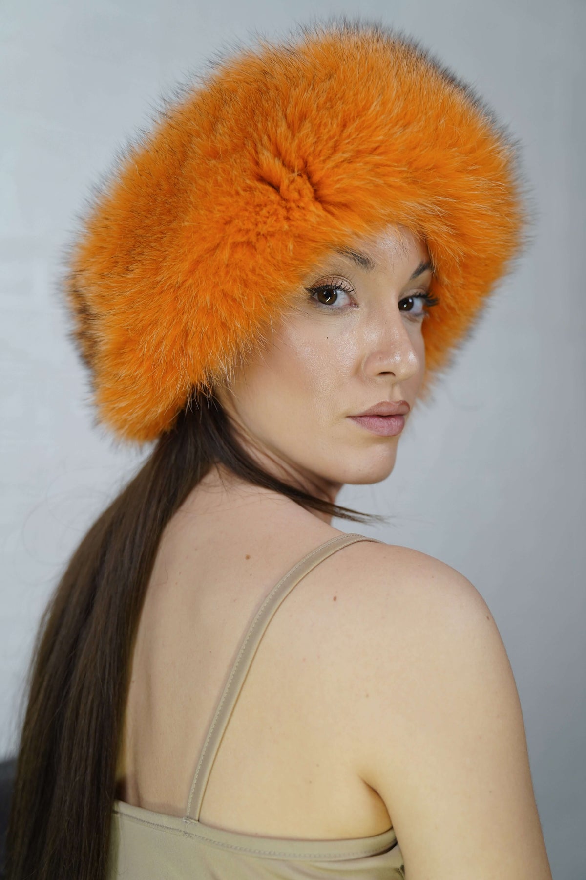 Fox Fur Headband Orange — Full Skin, Elastic three-quarter view displaying the volume and depth of the bright tangerine orange fur — Greek craftsmanship, TatiFurs