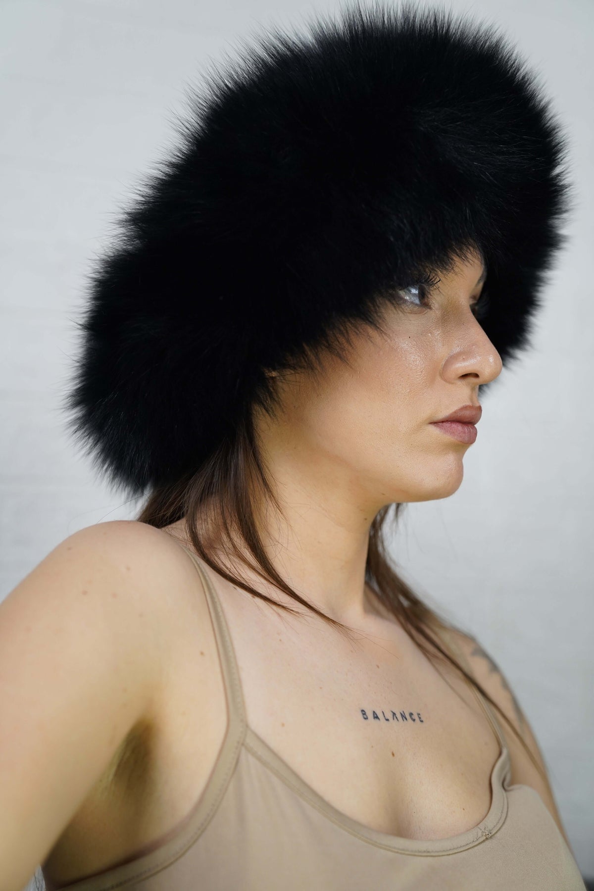Fox Fur Headband Black — Full Skin, Elastic — front view worn by a woman, TatiFurs