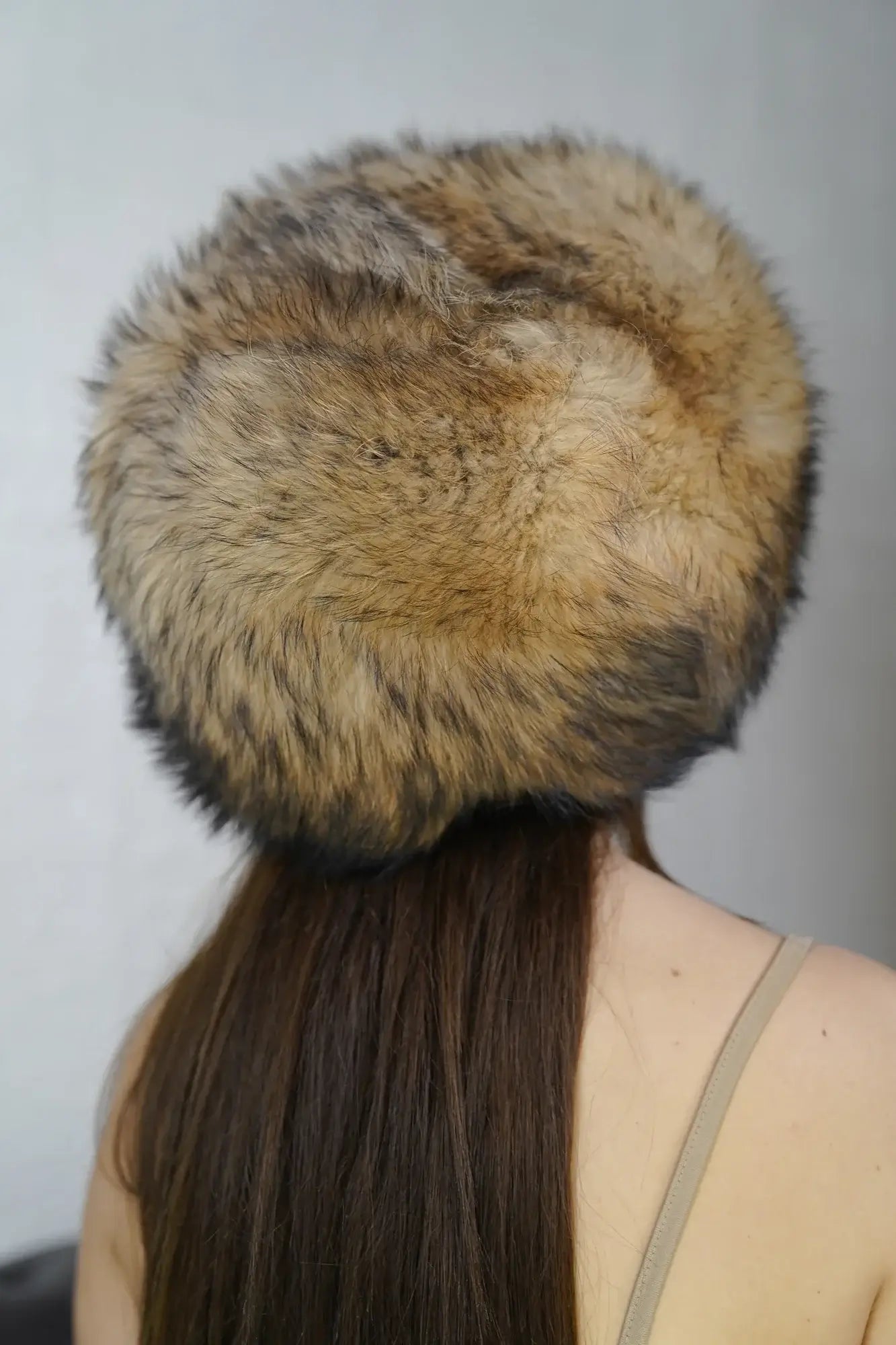 Finn raccoon hat natural worn showing full voluminous round Finnish raccoon fur silhouette and natural undyed warm tone from front — Greek craftsmanship, TatiFurs
