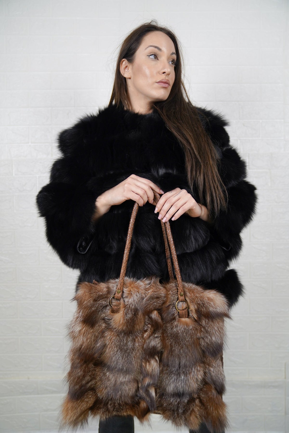 Fox Fur Bag Natural Crystal — Large Tote, Leather Handles — front view held by a model in a black fox fur jacket, brown braided leather handles, TatiFurs