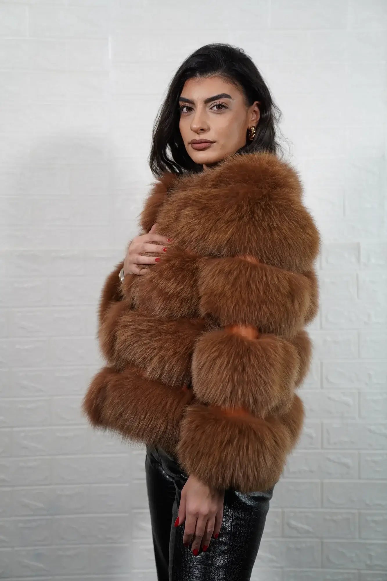 Fox fur jacket camel brown shown from the back displaying full hip level bomber silhouette and horizontal leather strip construction across camel brown fox rows — Greek craftsmanship, TatiFurs
