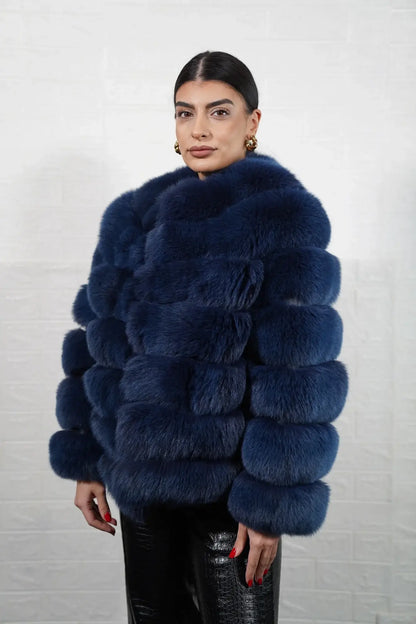 Fox fur jacket blue shown from the back displaying full hip level silhouette and horizontal leather strip construction across blue fox rows — Greek craftsmanship, TatiFurs
