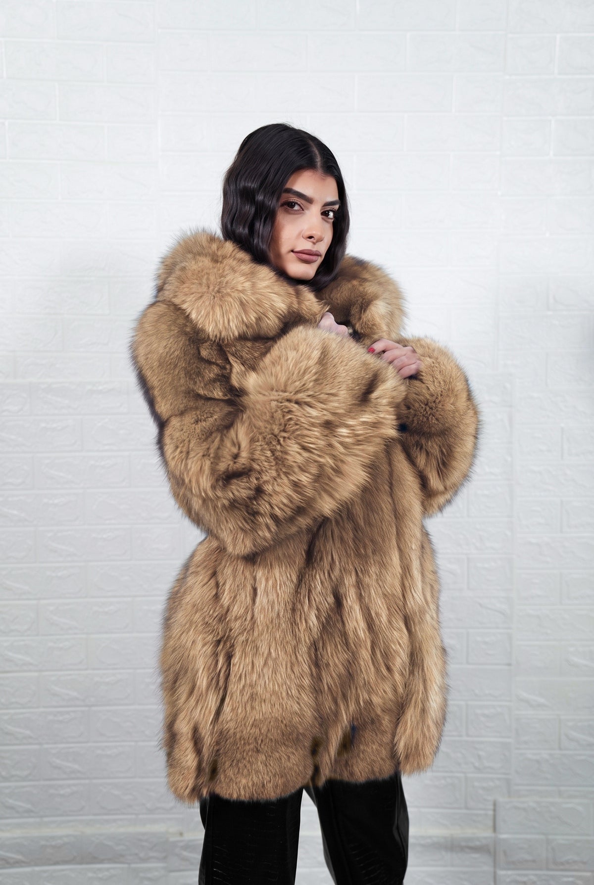 fox fur jacket camel brown collared worn with hands on the collar, wide fox fur sleeves in camel brown — Greek craftsmanship, TatiFurs