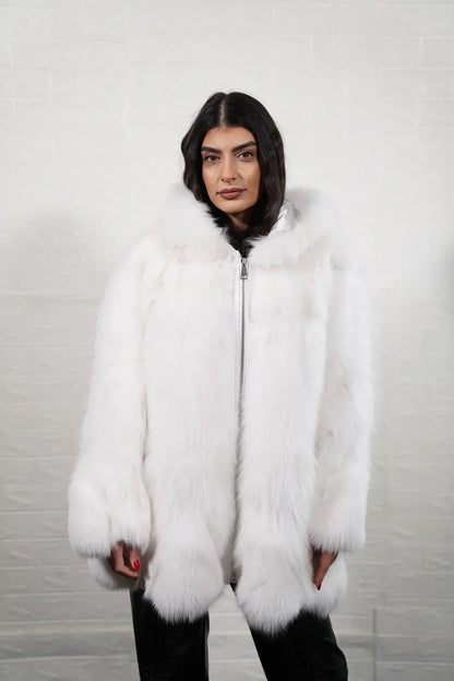Fox fur coat white shown from the side displaying above knee silhouette and uniform luminous white fox solid pattern surface — Greek craftsmanship, TatiFurs
