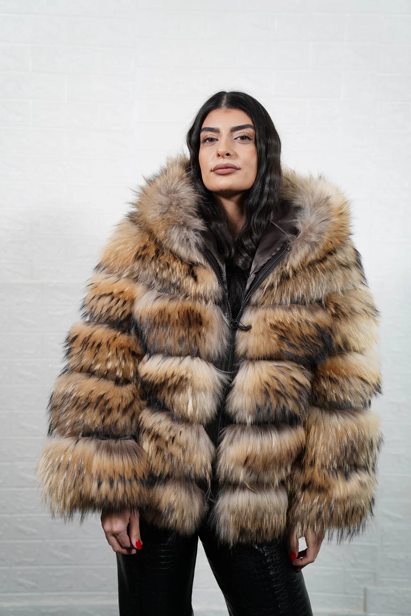 Finn raccoon fur jacket natural shown from the back displaying full hip level silhouette and horizontal leather strip construction across Finnish raccoon rows — Greek craftsmanship, TatiFurs

