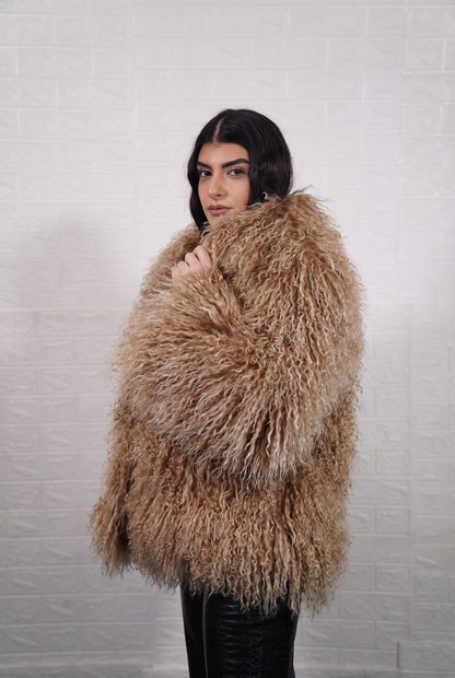 Mongolian jacket light brown shown from the side displaying hip level silhouette and warm honey light brown long curly Mongolian wool — Greek craftsmanship, TatiFurs