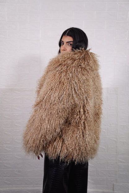 Mongolian jacket light brown shown from the back displaying full hip level silhouette and consistent warm honey light brown curly wool surface — Greek craftsmanship, TatiFurs