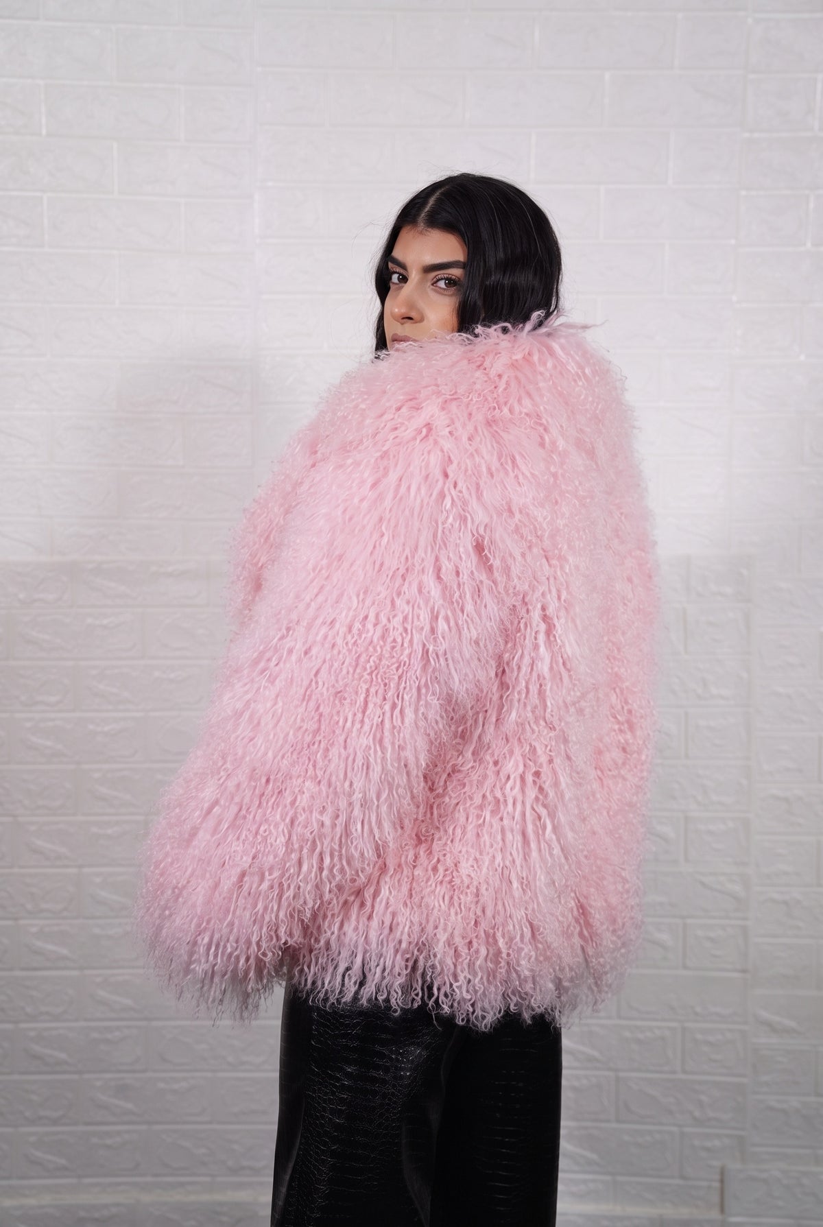 Mongolian jacket pink shown from the back displaying full hip level silhouette and consistent soft blush pink curly wool surface — Greek craftsmanship, TatiFurs