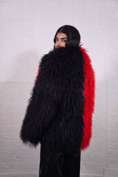 Mongolian jacket red black shown from the back displaying full hip level silhouette and consistent bold scarlet red with jet black curly wool surface — Greek craftsmanship, TatiFurs