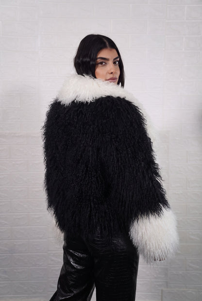 Mongolian jacket black and white women three-quarter view displaying collar frame and voluminous jet black with ivory white Mongolian wool sheepskin — Greek craftsmanship, TatiFurs