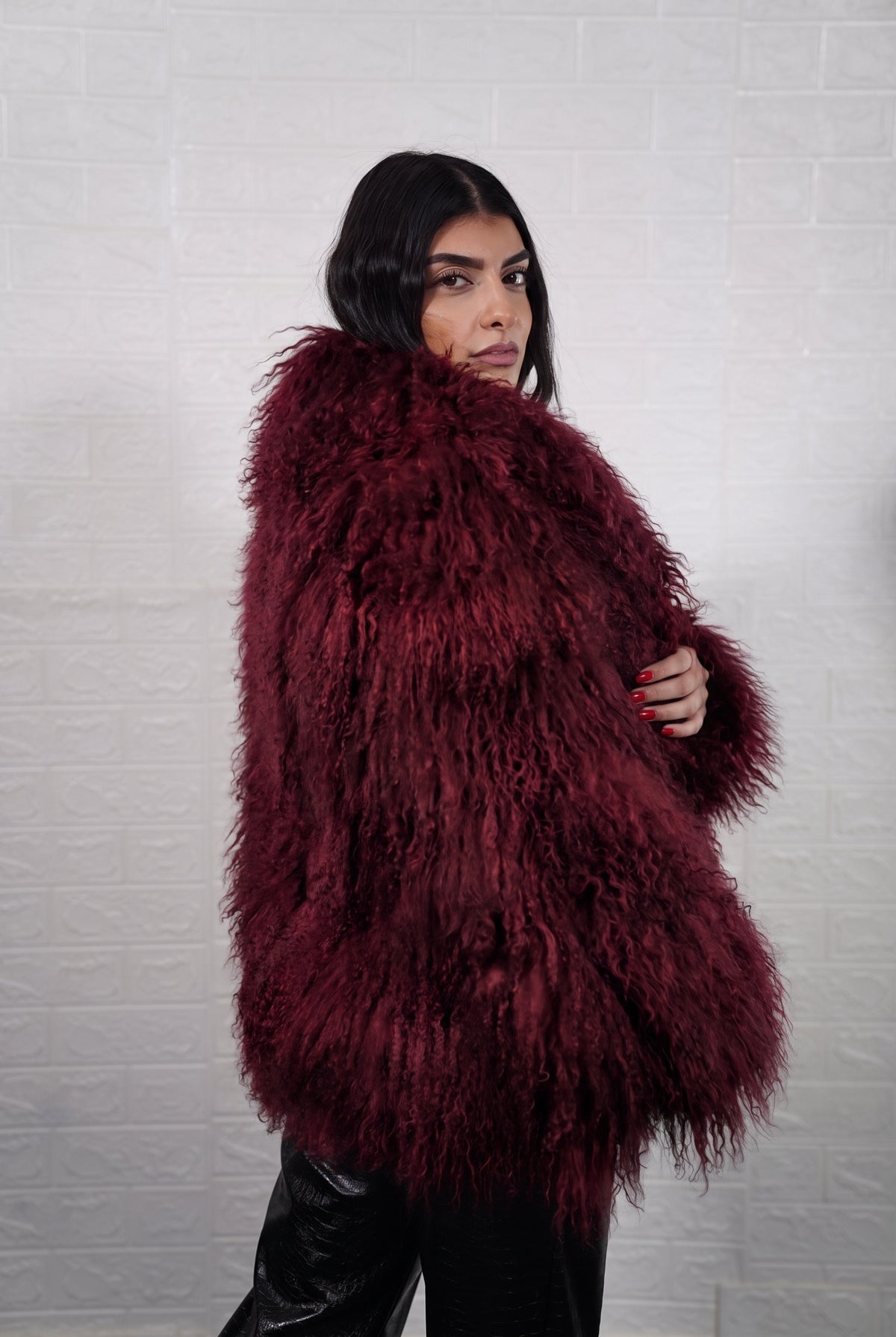 Mongolian jacket burgundy women three-quarter view displaying collar frame and voluminous deep wine burgundy Mongolian wool sheepskin — Greek craftsmanship, TatiFurs