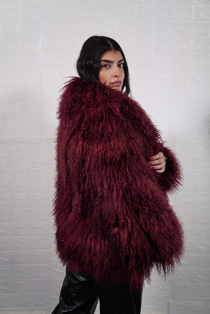 Mongolian jacket burgundy women three-quarter view displaying collar frame and voluminous deep wine burgundy Mongolian wool sheepskin — Greek craftsmanship, TatiFurs