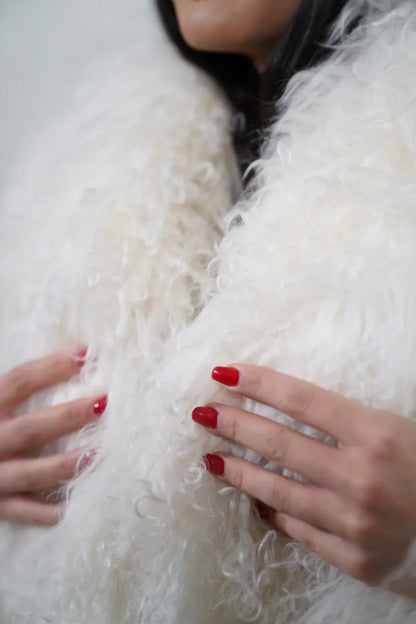 Mongolian jacket white shown from the side displaying hip level silhouette and pure white Mongolian sheepskin leather exterior — Greek craftsmanship, TatiFurs
