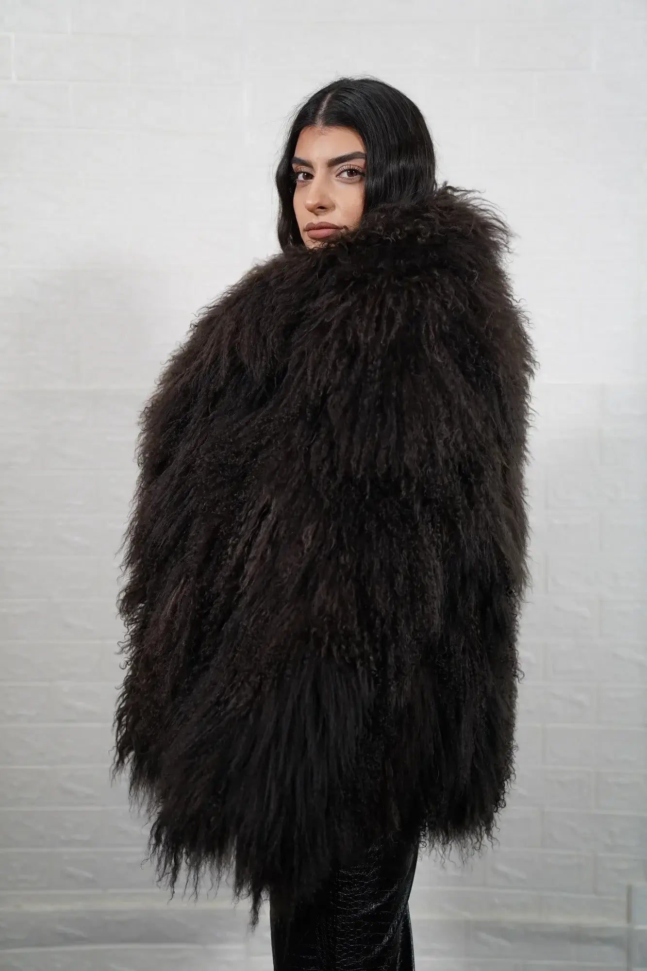 Mongolian jacket brown displaying deep warm brown sheepskin leather exterior and hip level collar silhouette — Greek craftsmanship, TatiFurs
