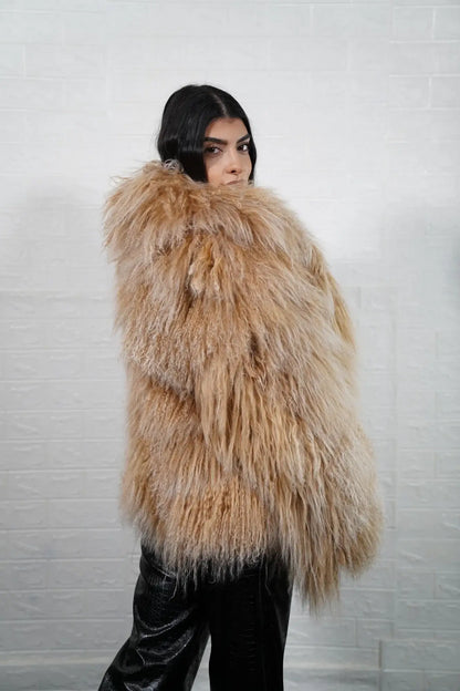Mongolian jacket camel brown detail shot showing warm camel brown sheepskin leather exterior quality and natural wool lining from collar to hip level hem — Greek craftsmanship, TatiFurs
