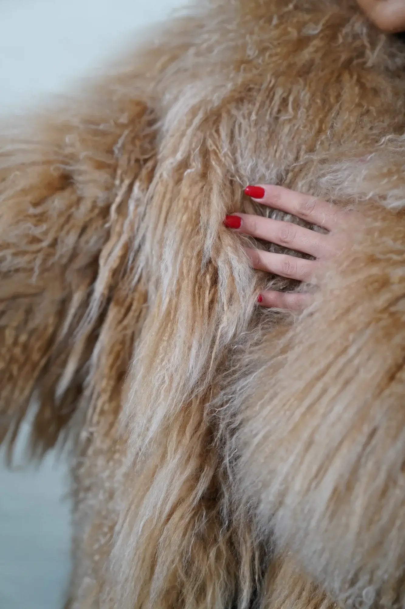 Mongolian jacket camel brown close-up texture showing camel brown sheepskin leather exterior and natural wool lining quality — Greek craftsmanship, TatiFurs
