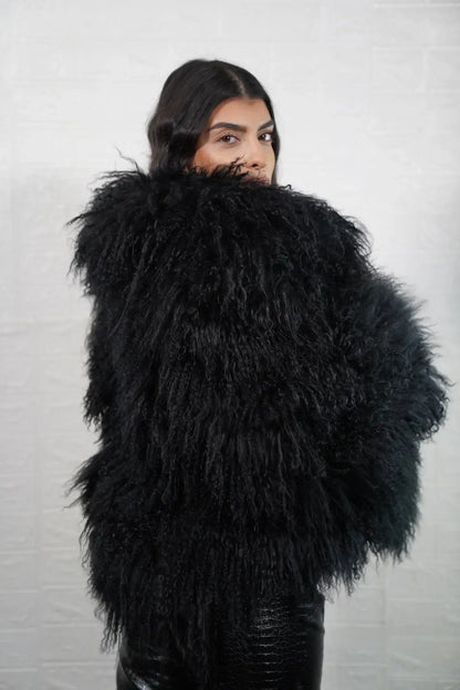 Mongolian jacket black shown from the back displaying full hip level silhouette and consistent deep black Mongolian sheepskin surface — Greek craftsmanship, TatiFurs
