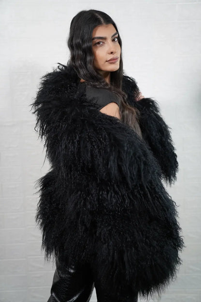 Mongolian jacket black collar close-up showing precise skin matching between collar and shoulder in deep black Mongolian wool sheepskin — Greek craftsmanship, TatiFurs
